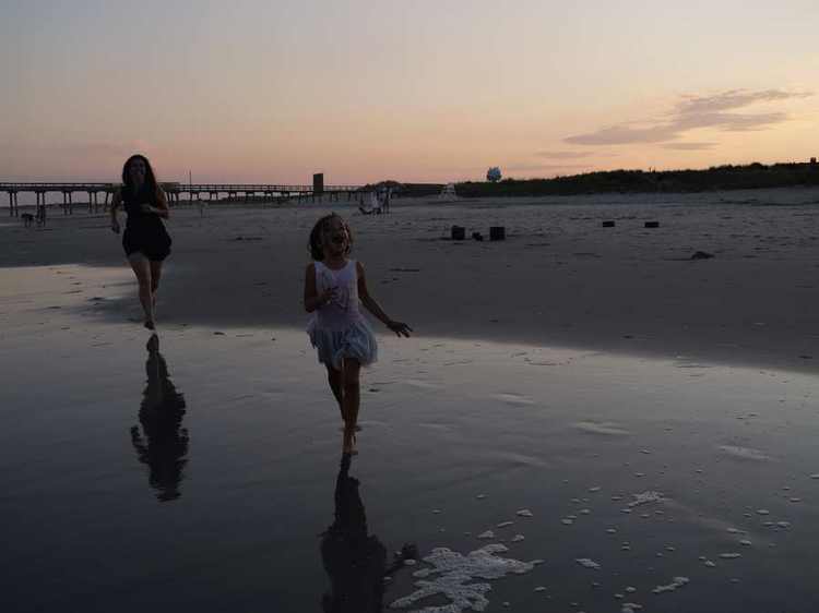 Devin Alexander with her daughter at the beach